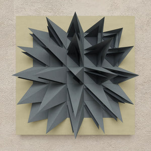 Paragami handmade geometric wall art with 3D gray spikes on beige, inspired by paper folding. — Paragami
