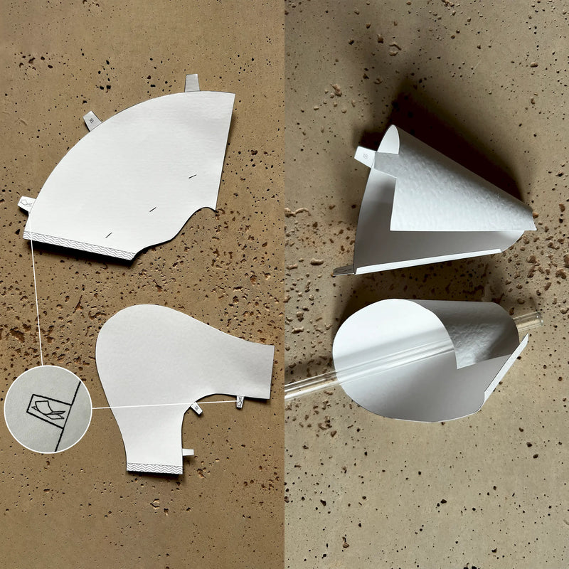 DIY paper art project combining circles, ellipses, and curved surfaces into a modern three-dimensional pattern.