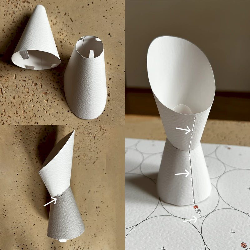 Creating smooth paper cones by gently rolling cardstock with a wooden rod on a soft surface for abstract paper wall decor.