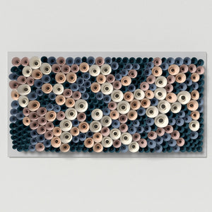 Abstract modular wall art inspired by coral sponge structures, assembled from folded paper cones and circular forms.